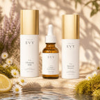 The Renewal Ritual: N° 01 Cleansing Milk, N° 04 Copper Concentrate and N° 03 Renewal Essence on stone by water with daisies, lemon and moss