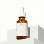 N° 04 Copper Concentrate amber dropper bottle on a white plinth